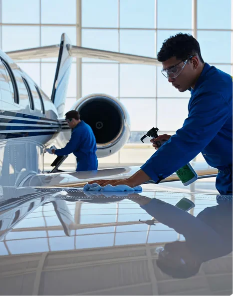 Professional aircraft detailing technician washing aircraft exterior with water in Phoenix Arizona
