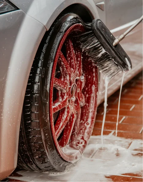 Luxury vehicle receiving professional wash, polish, and detailing service in Arizona