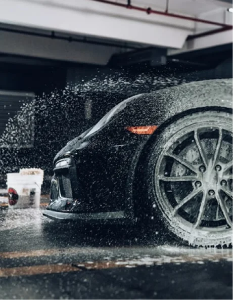 Luxury car interior deep cleaning focusing on steering wheel sanitization and restoration