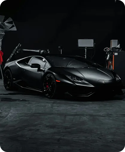 High-end Lamborghini supercar in dark studio environment showcasing premium detailing and design